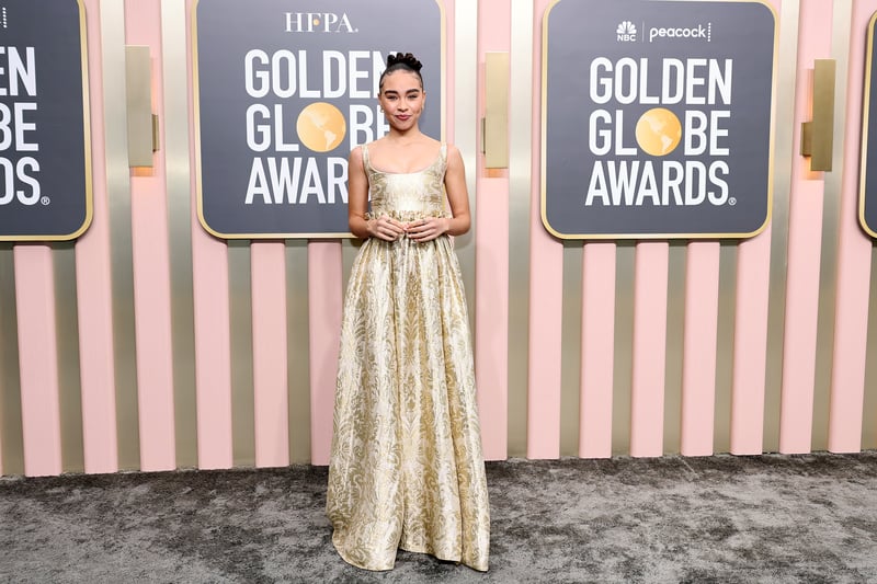 Bailey Bass wore a colour appropriate gold Dior dress.