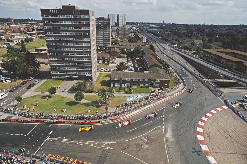 Crowds of spectators watch the race action as Eddie Irvine drives the #2 Eddie Jordan Racing Reynard 90D - Smith Mugen through the streets during the FIA International F3000 Championship Halfords Birmingham Superprix race on 27 August 1990 on the streets of Birmingham, Great Britain. (Photo by Russell Cheyne/Getty Images)