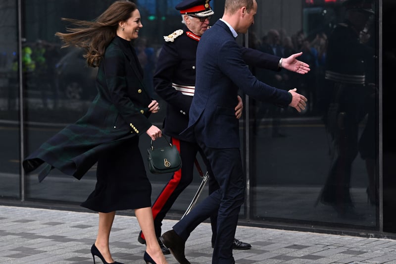 A windswept William and Kate arrive to visit the Royal Liverpool University Hospital.