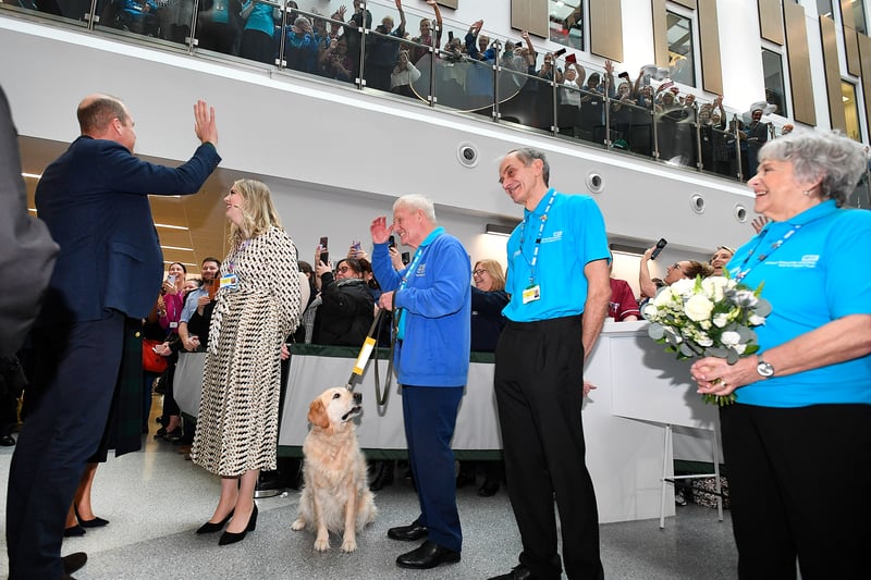 Prince William waves to satff on the upper floor of Royal Liverpool University Hospital.