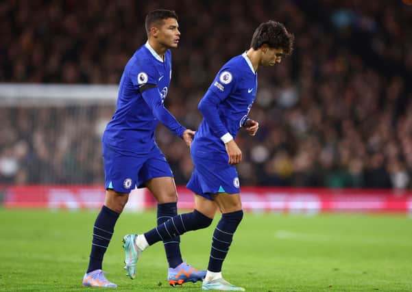 Thiago Silva of Chelsea interacts with Joao Felix of Chelsea as he leaves the pitch after receiving a red card during the Premier League match (Photo by Clive Rose/Getty Images)
