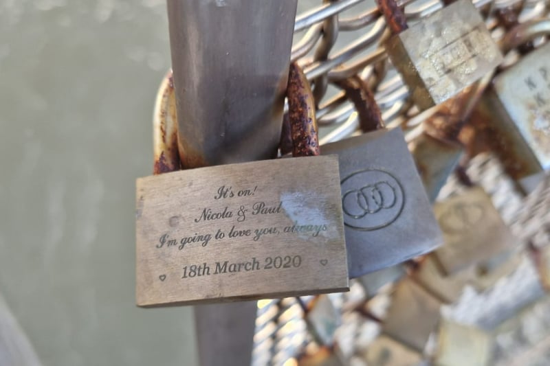 Most padlocks left on the bridge are used to declare love or make significant events such as weddings - like this one.