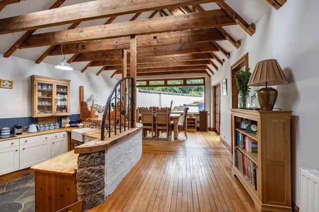The property is designed with gorgeous wooden flooring and period features