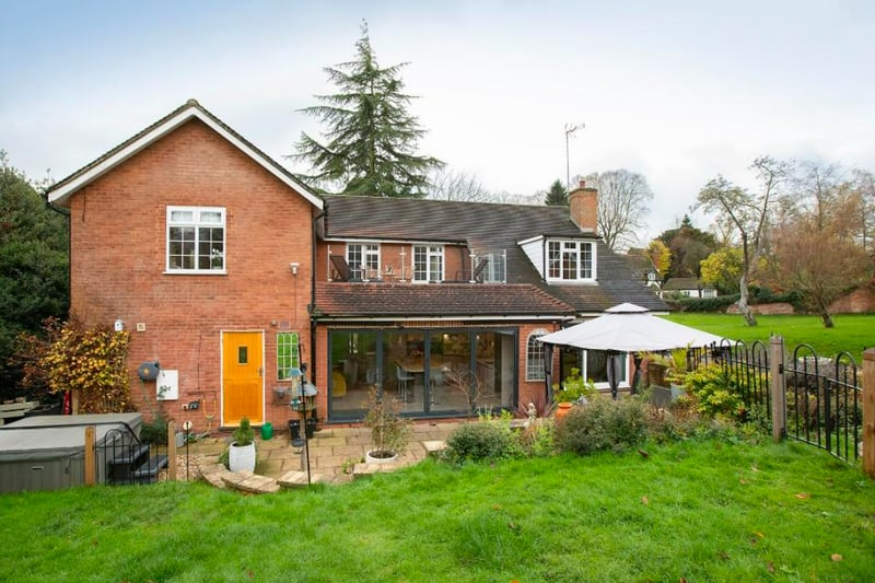 The house has a gated entrance with large driveway taking you to the rear of the property, where there is ample parking and access to the double garage and three stables.  (Photo - Rightmove)