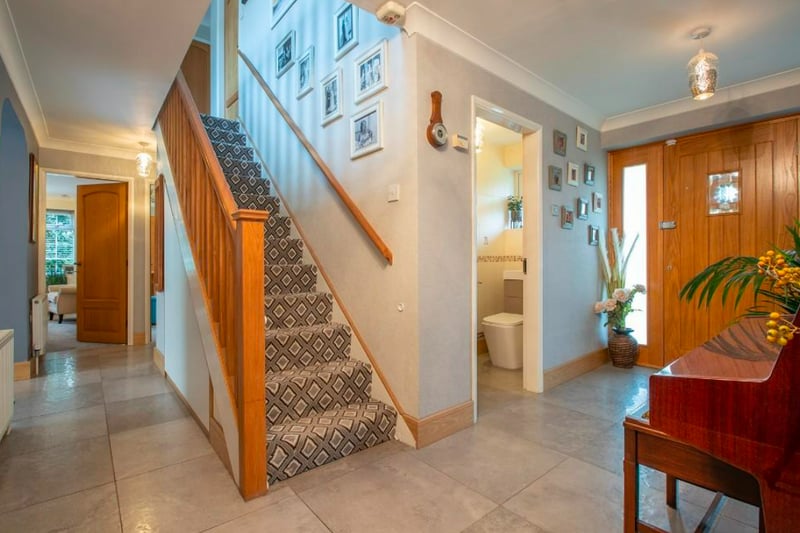 The entry way has refitted oak staircase to first floor, fitted storage, underfloor heating and oak doors leading off.  (Photo - Rightmove)