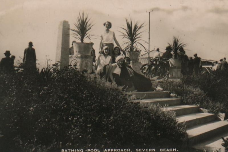 A group of girls pose at the entrance of the bathing pool