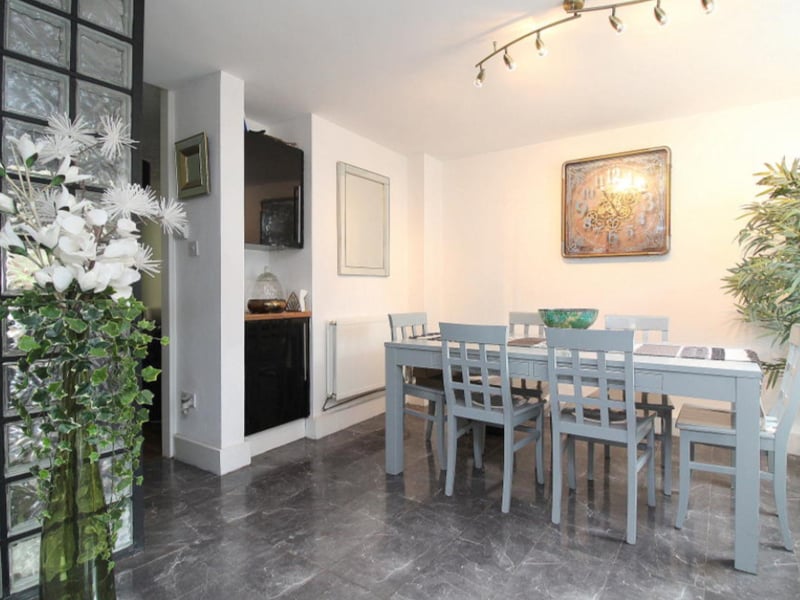 The dining area has ample space and natural light.