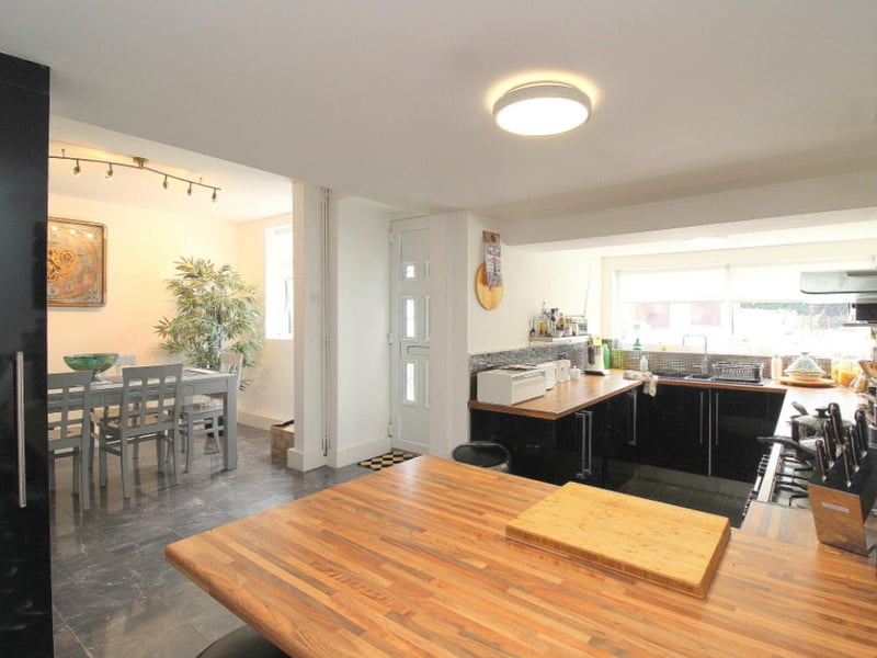 The property starts with a large kitchen/diner, with modern fixtures and flooring. 