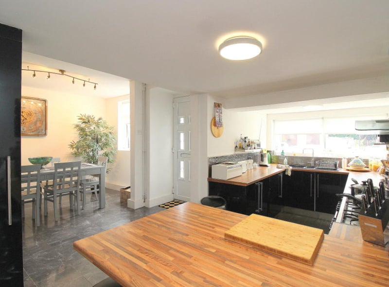 The property starts with a large kitchen/diner, with modern fixtures and flooring. 