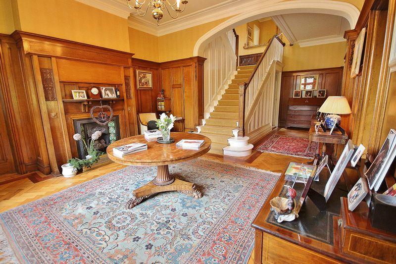 The entrance hall with oak wood flooring is quite the spectacle.
