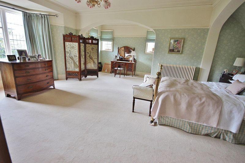 A comfortable and spacious master bedroom, perfect for rest before and after clashes for a Champions League place.