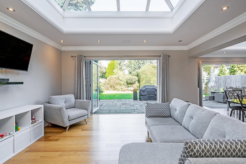 Outside is a spacious patio across the whole of the rear and a mature garden with plenty of established shrubs, mainly laid to lawn, with electric gates at the front leading to a drive with comfortable parking for four cars.