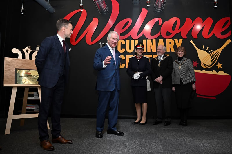 King Charles III unveils a plaque during a visit to the Kellogg’s in Trafford Park Credit: PA pool
