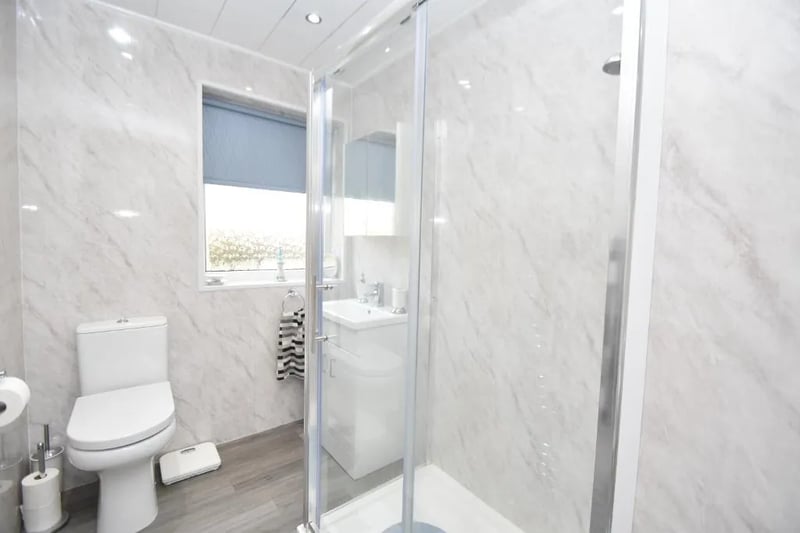 The three-piece shower room inside the property 