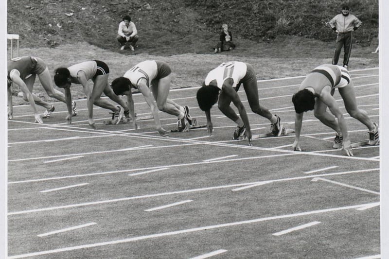 Athletes take their positions on the start line of the Women’s 100m event held at the Whitchurch Sports Stadium.