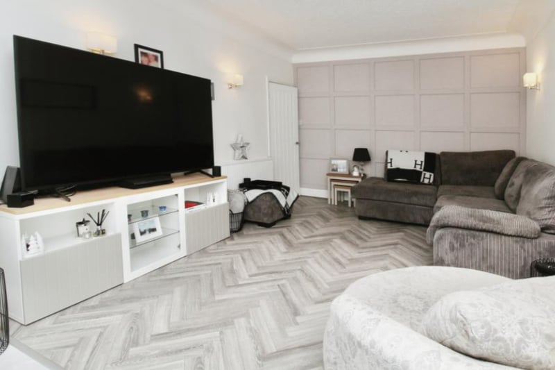 The living room has lovely parquet flooring.