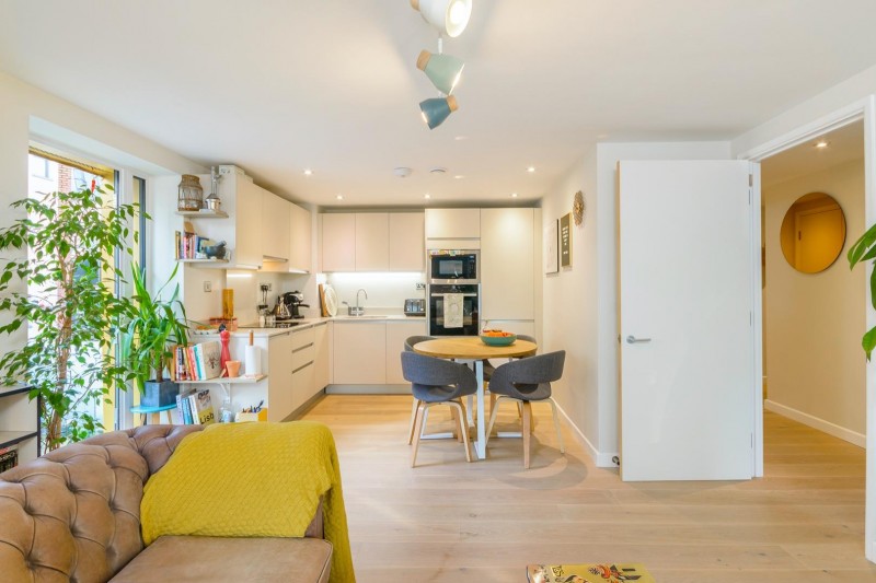 The living space and kitchen are shared in one room with entrances to the terrace outside
