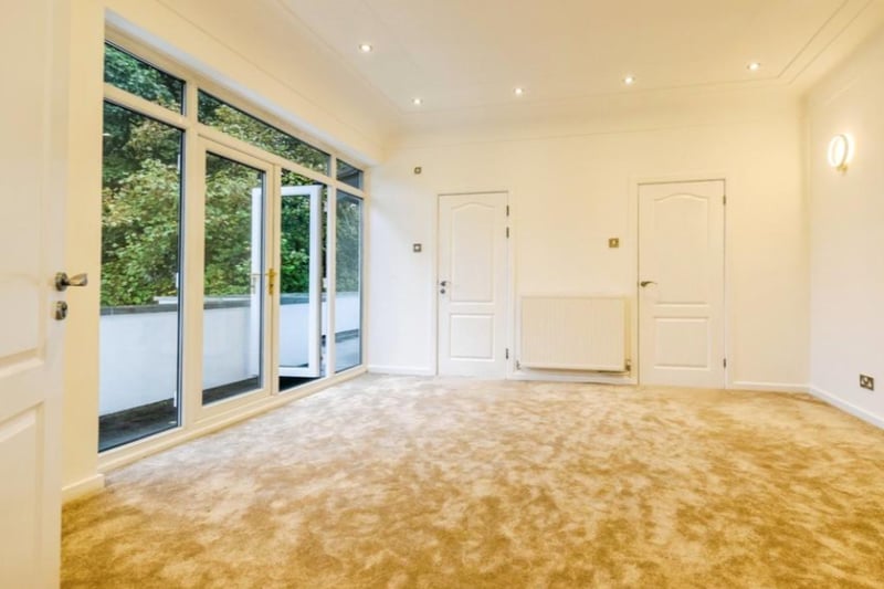 The second bedroom has en suite, walk in wardrobe and balcony overlooking the rear garden.
