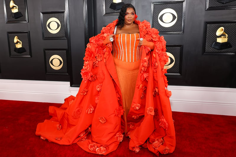 Lizzo, who won Record of the Year for About Damn Time, wore a statement floral gown from Dolce & Gabbana, complete with cape.