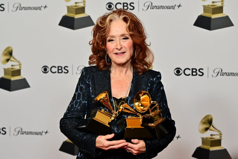 Bonnie Raitt holds the awards for Best American Performance, Best American Roots Song, and Song of the Year for Just Like That.