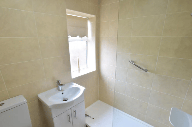 A standard bathroom with all of the usual amenities, and looks quite modern with stylish tiles