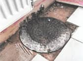 A manhole had been placed over a hole in the lounge of a property. Image: Liverpool City Council