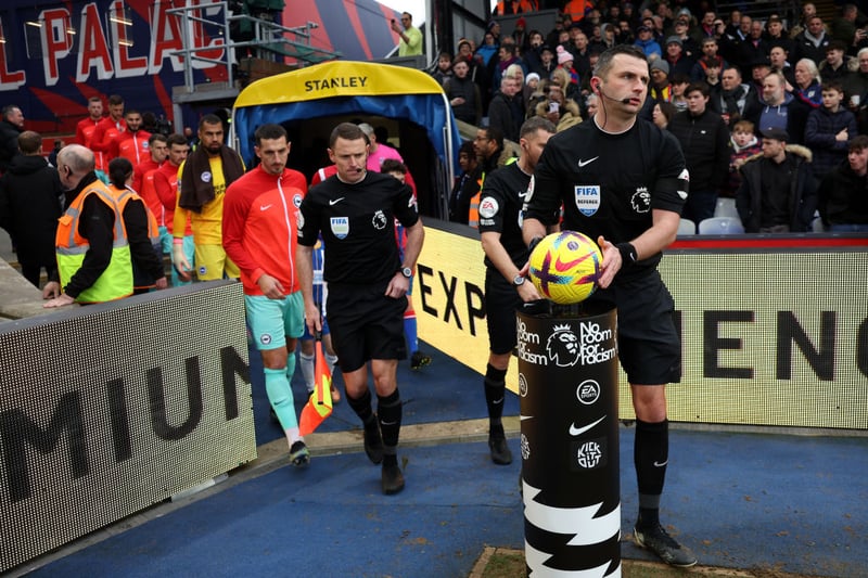 Match Referee Michael Oliver takes the ball from a plinth which reads  ‘No Room For Racism’ prior to the Premier League match 