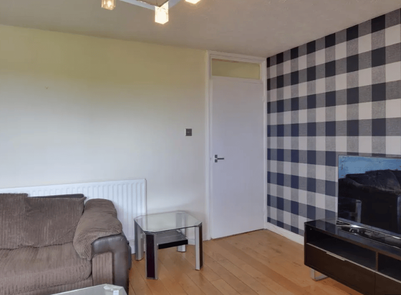 The other view of the main room, with great space despite the rest of the large sofa, TV and TV stand