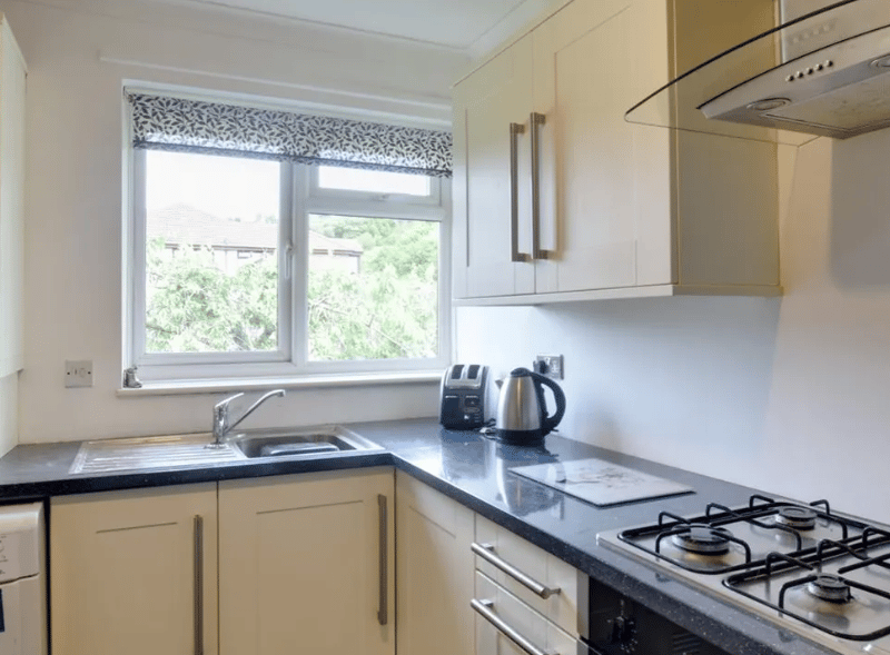 A view of the kitchen with lovely modern hobs and good views of the outside, with natural light easily flooding in