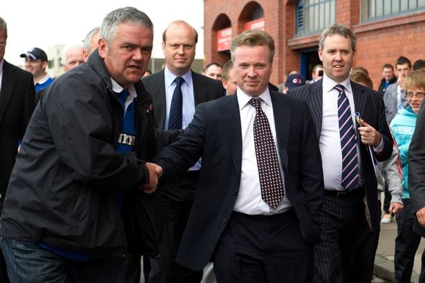 Former Rangers owned Craig Whyte is welcomed by supporters after taking over the Ibrox club in May 2011