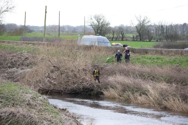 Police searching the River Wyre where a body was found