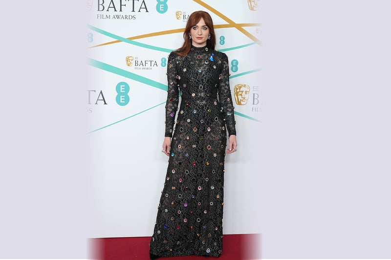 Sophie Turner opted for an elegant black high neck lace gown from Louis Vuitton which was encrusted with multi-coloured jewels.