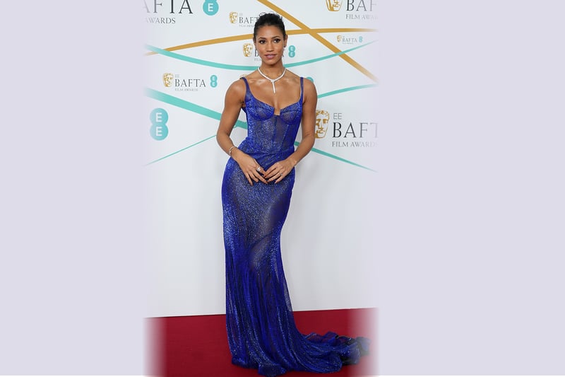 Another celeb who looked beautiful in blue was Vick Hope. Her figure hugging iridescent gown shone on the red carpet with its corset design. The look was finished with a sparkly diamond necklace.