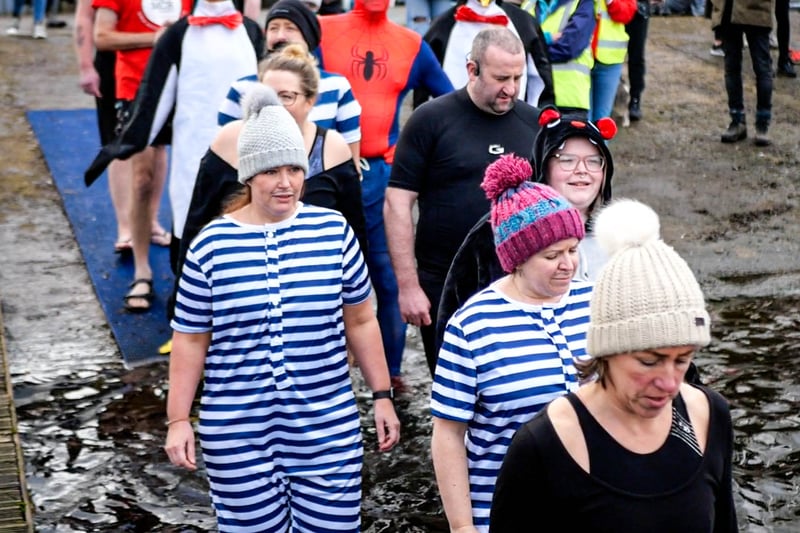 Brave dippers prepare to enter the freezing water at Sale Water Park to raise money for the We Love MCR charity. Photo: Dylan O’Brien