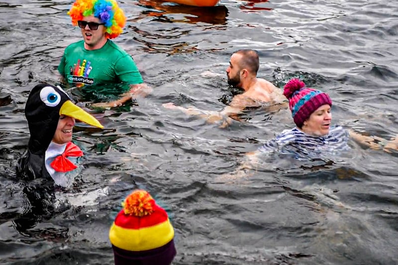 Some of the 80 hardy dippers who ventured into the water, which was just six degrees Celsius. Photo: Dylan O’Brien