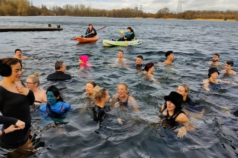 Some of the participants in the freezing water at Sale Water Park for the We Love MCR charity dip. Photo: We Love MCR
