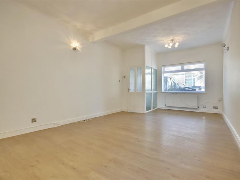 View of the front door area and lounge