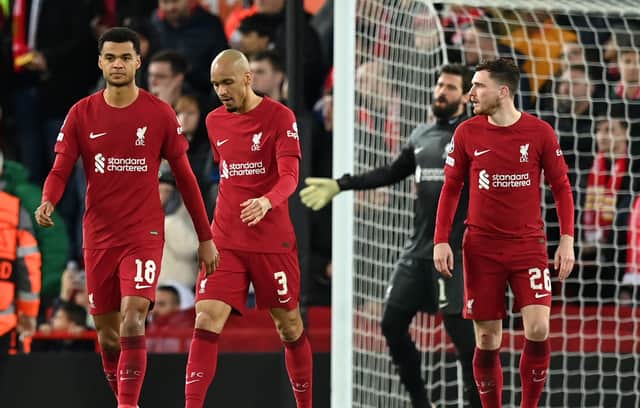 Players of Liverpool looks dejected after Karim Benzema of Real Madrid ( not pictured ) scores their side's fourth goal during the UEFA Champions League round of 16 leg one match between Liverpool FC and Real Madrid at Anfield on February 21, 2023 in Liverpool, England. (Photo by Michael Regan/Getty Images)