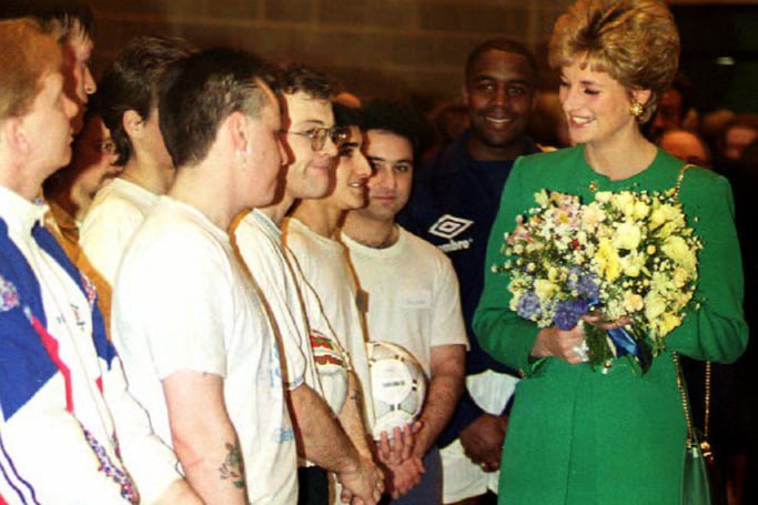 Diana, Princess of Wales, talks with members of a disabled soccer team on February 25, 1993.  (Picture: Johnny Eggitt/AFP via Getty Images)