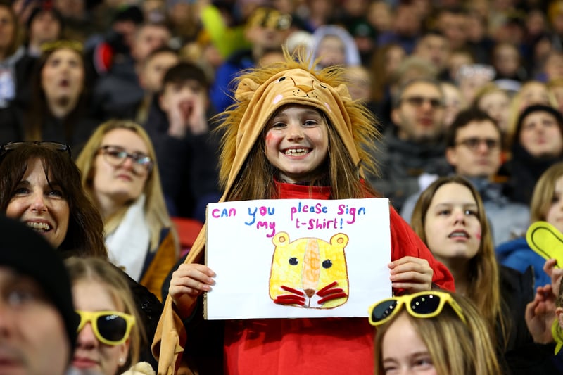 A young England supporter with a Lion headscarf 