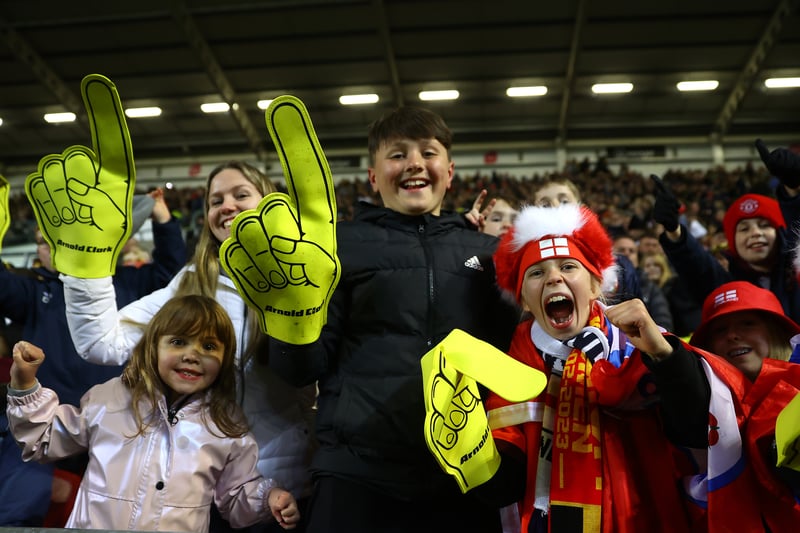 More fans with Arnold Clark foam fingers and England headwear