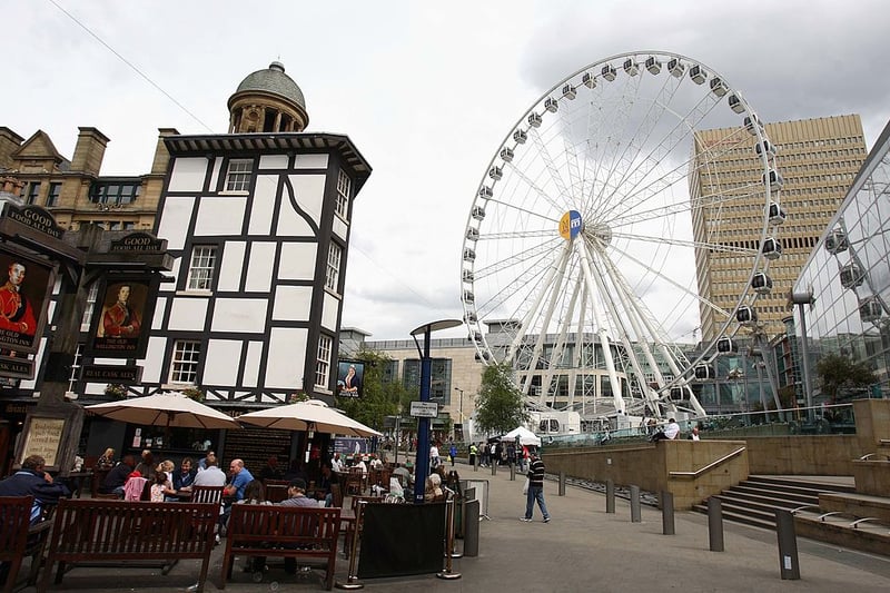 Often referred to as the Manchester Eye, the giant ferris wheel appeared on Exchange Square in 2004. It moved to Piccadilly Gardens when work on the tramlines began before being dismantled in 2015. Credit: Getty Images