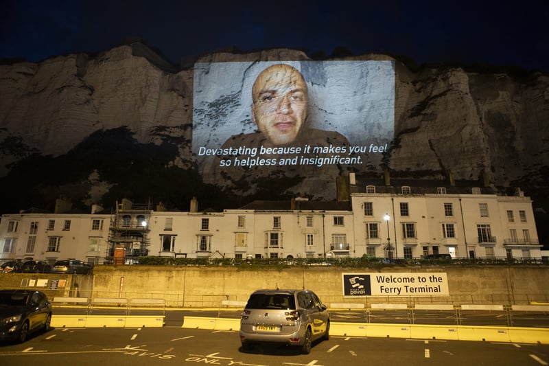 In August 2020, the group lit up  the White Cliffs of Dover with a giant video of Mr Akkad, a Syrian refugee who crossed to Britain several years ago. In the video, he spoke about the“terrifying and devastating” journeys he said many people are making to reach the UK by boat, and blamed the Government for using the crisis as a distraction from the coronavirus pandemic.