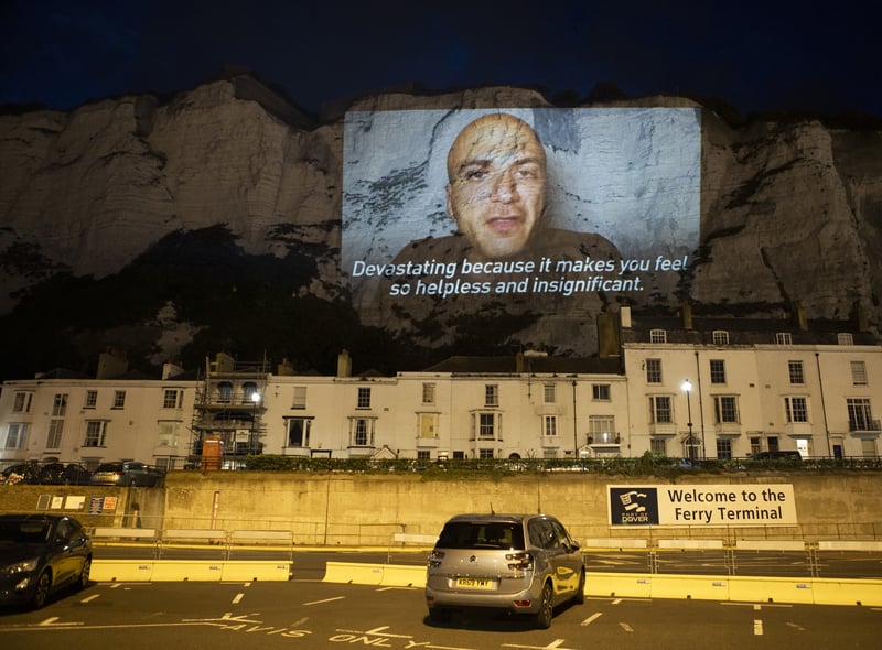 In August 2020, the group lit up  the White Cliffs of Dover with a giant video of Mr Akkad, a Syrian refugee who crossed to Britain several years ago. In the video, he spoke about the“terrifying and devastating” journeys he said many people are making to reach the UK by boat, and blamed the Government for using the crisis as a distraction from the coronavirus pandemic.