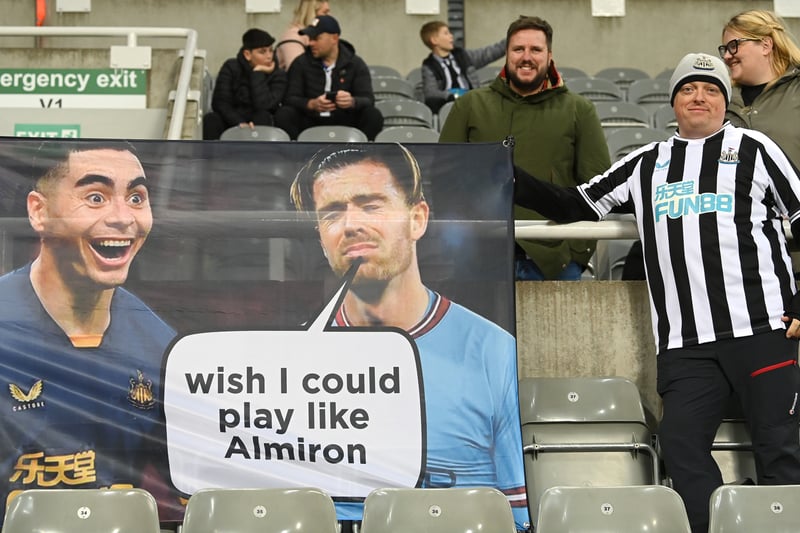 A flag held by a Newcastle fan shows Newcastle player Miguel Almiron and Manchester City player Jack Grealish prior to the Premier League match between Newcastle United and Chelsea FC at St. James Park on November 12, 2022.