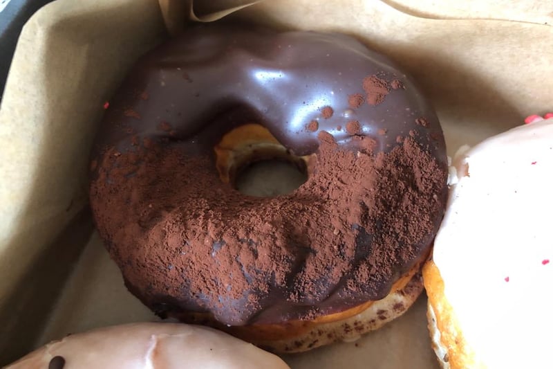 Rich and indulgent, this luxury doughnut has a thick layer of dark chocolate and a light dusting of bitter cocoa powder