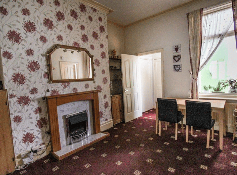 A first look at the inside of the property, with a small dining area and a retro fireplace