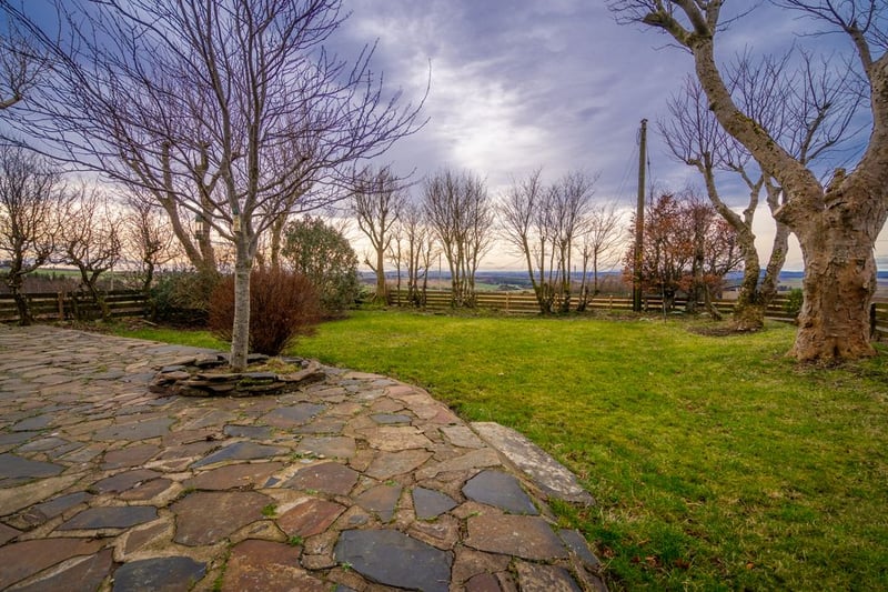 The property offers stunning views toward the outline of Bennachie on the horizon
