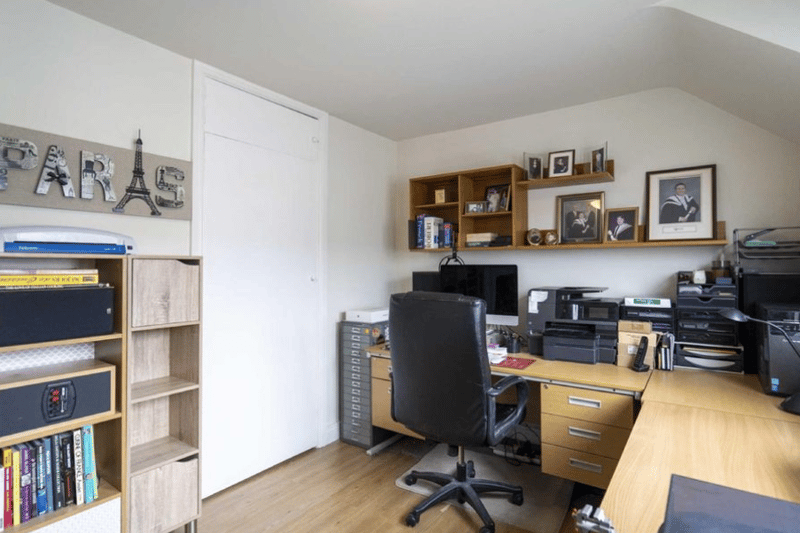 This room has clearly been used as a home office - you could keep it like this or mate it in a games room