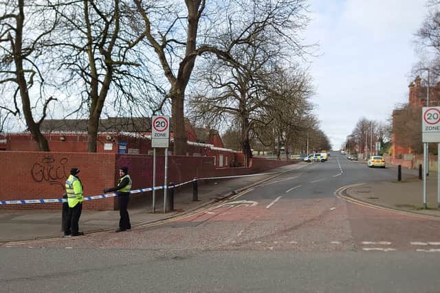 Police officers guarding the cordon on Spencer Place 